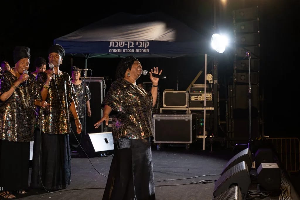 Night stage performance during a Village of Peace cultural gathering