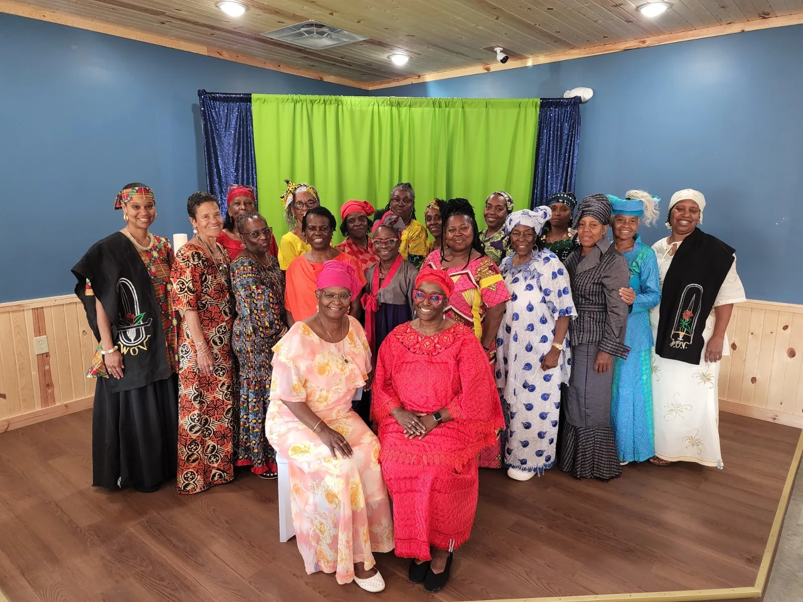 Sisters of the Village of Peace in vibrant traditional dress at a community celebration, Dimona